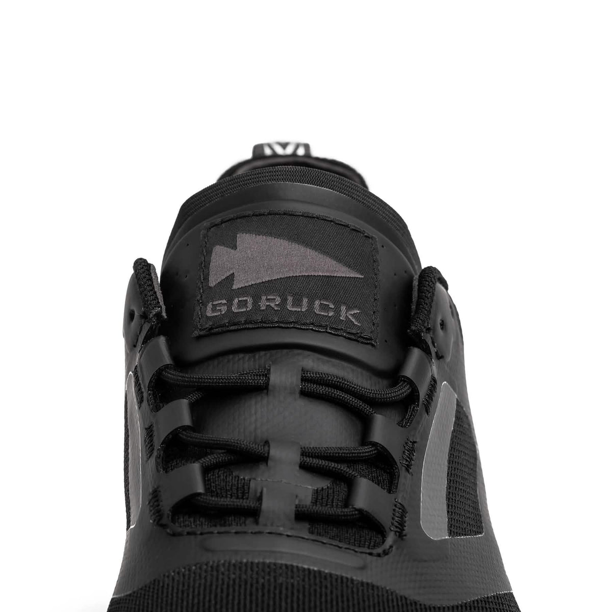 Close-up of black GORUCK rucking shoe with logo on tongue and durable laces
