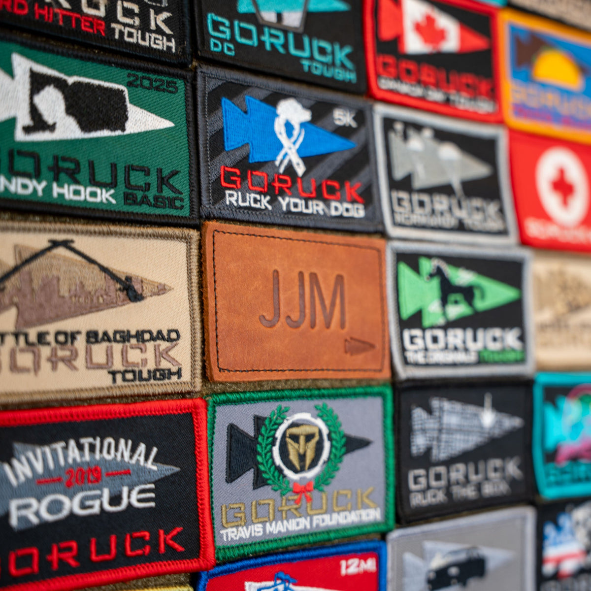 Patch - Custom Leather Monogram: Vibrant embroidered leather patches, perfect for adding custom initials or gifting a personalized touch, neatly arranged for easy selection.