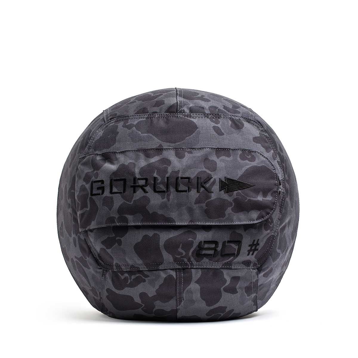 The Sand Medicine Ball in black camo features "GORUCK," an arrow logo, and "80" embroidery—ideal for enhancing core stability in your home gym.
