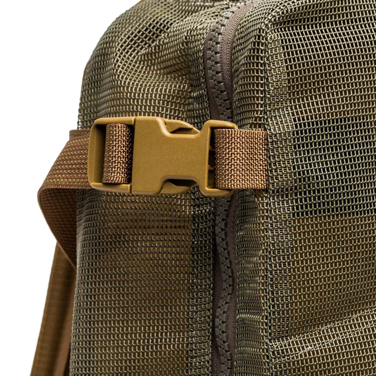 Close-up of GORUCK mesh rucksack in ranger green with sturdy sand-colored buckle
