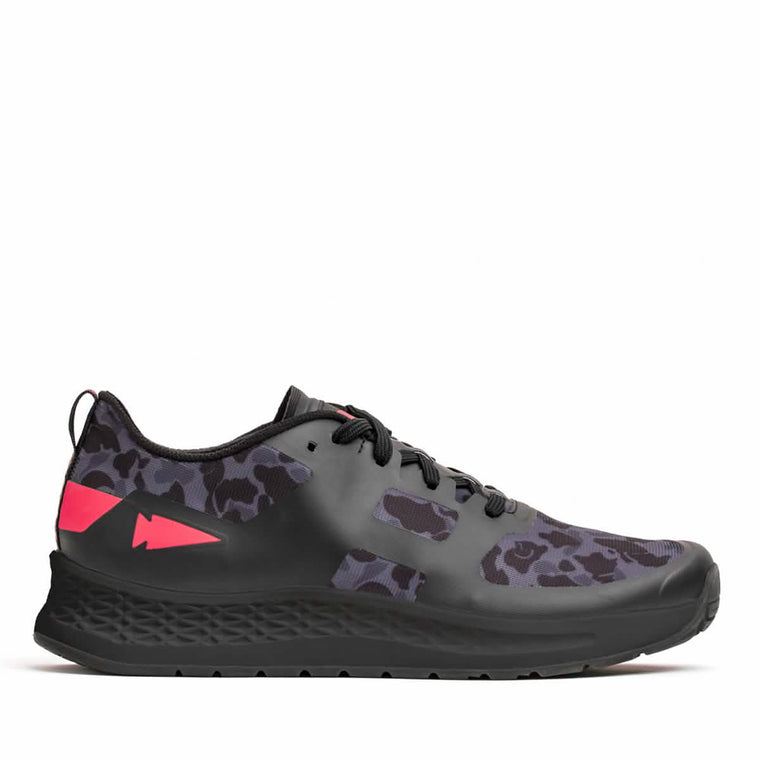 The Rough Runner - Midnight Frogskin + High Risk Red by GORUCK is a black sneaker featuring grey animal print accents and pink detailing on the back and sides. It is designed for high mileage running, with a Gradient Density EVA Midsole, black laces, and a textured black sole to ensure maximum comfort and durability.