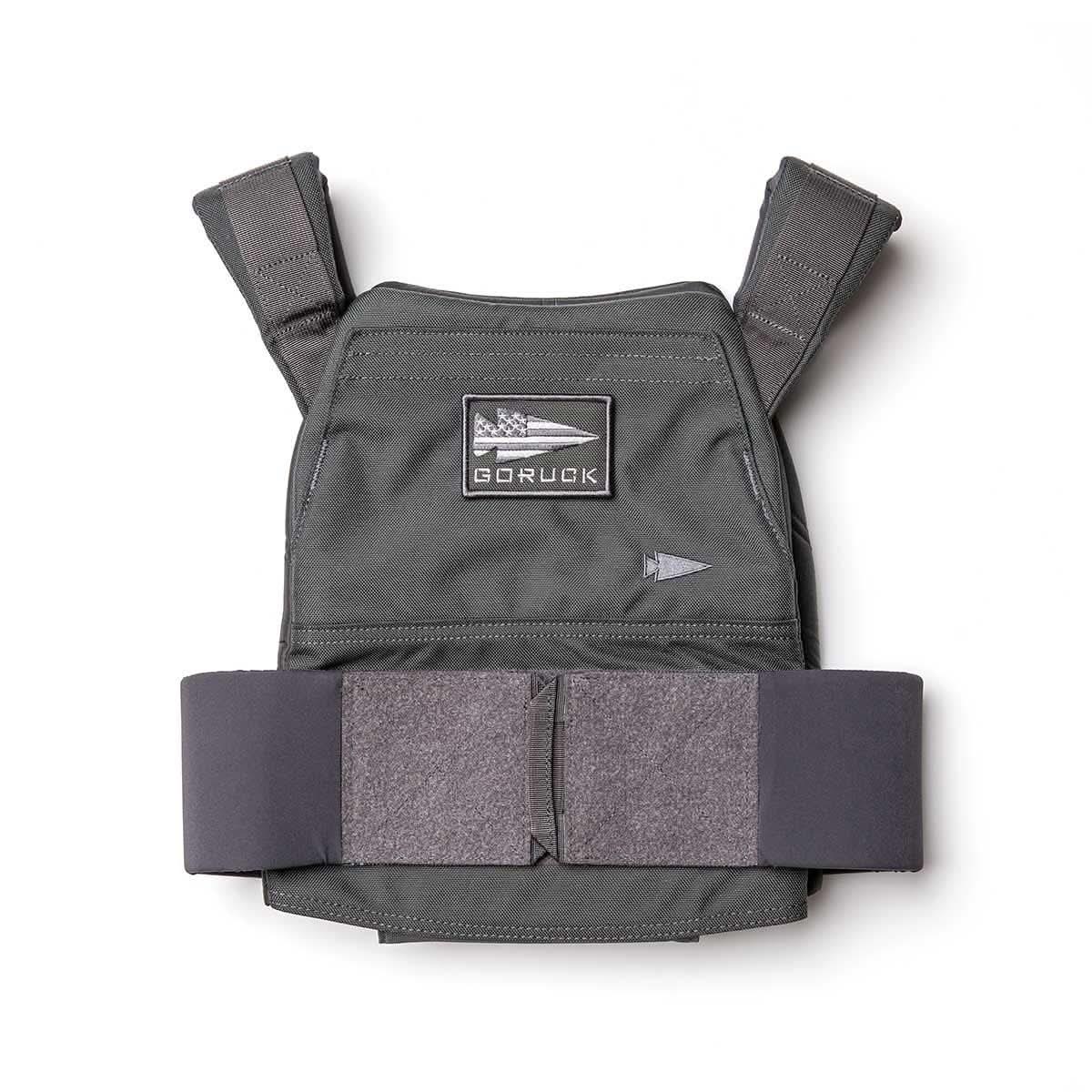 Gray GORUCK weight vest featuring a flag patch on the chest and a wide velcro waist strap designed for rucking.