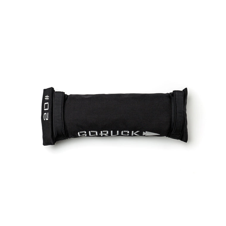 A black Simple Training Sandbags with "20" on one end lies on a white background—ideal for sandbag workouts and upgrading your home gym.