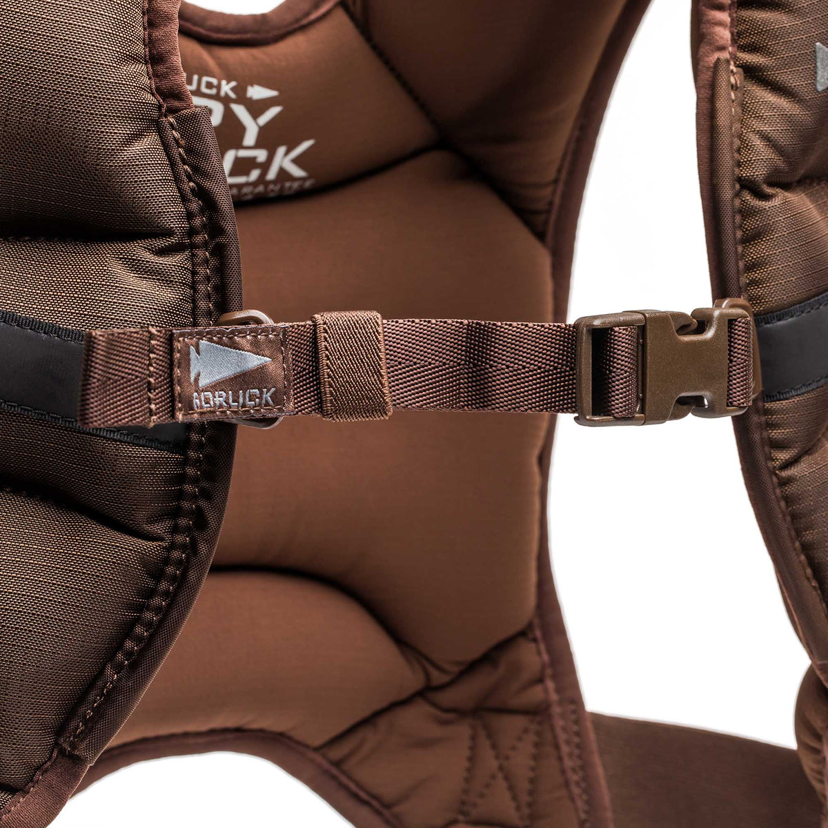 Close-up of a brown padded shoulder strap with a plastic buckle, "Adruck" branding, and a GORUCK-inspired design on the Spy Ruck | Women's Weighted Vest.