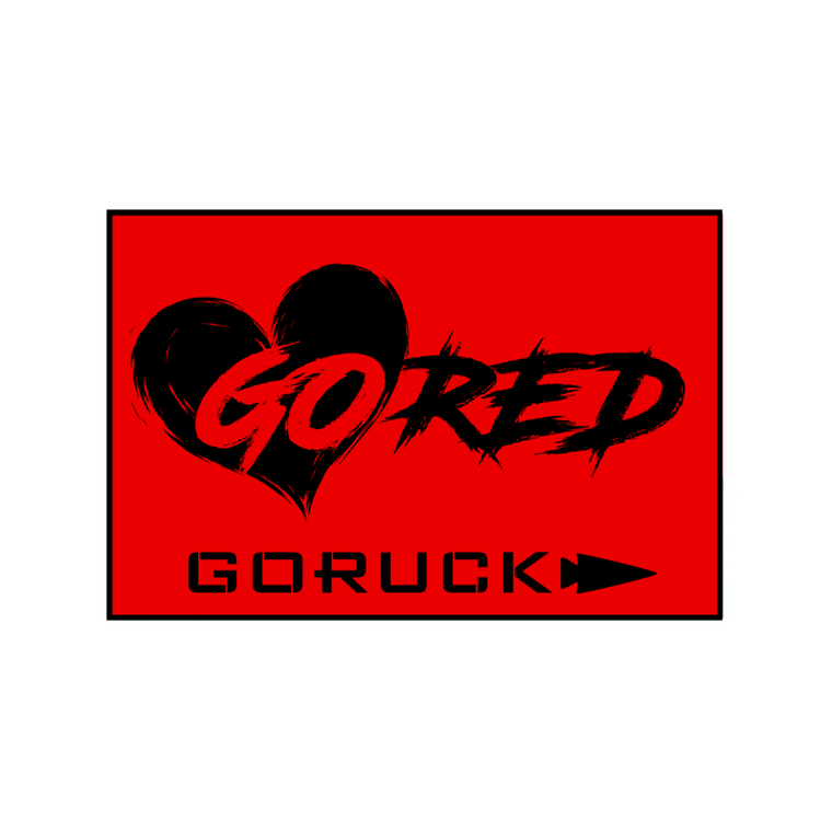 Red rectangular patch featuring a black heart, the brushstroke text “GO RED” for this American Heart Association fundraiser, and “GORUCK” with an arrow icon below.