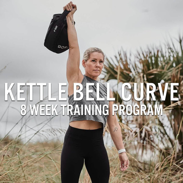Woman outdoors lifting GORUCK kettlebell, promoting Kettlebell Curve 8 week training program