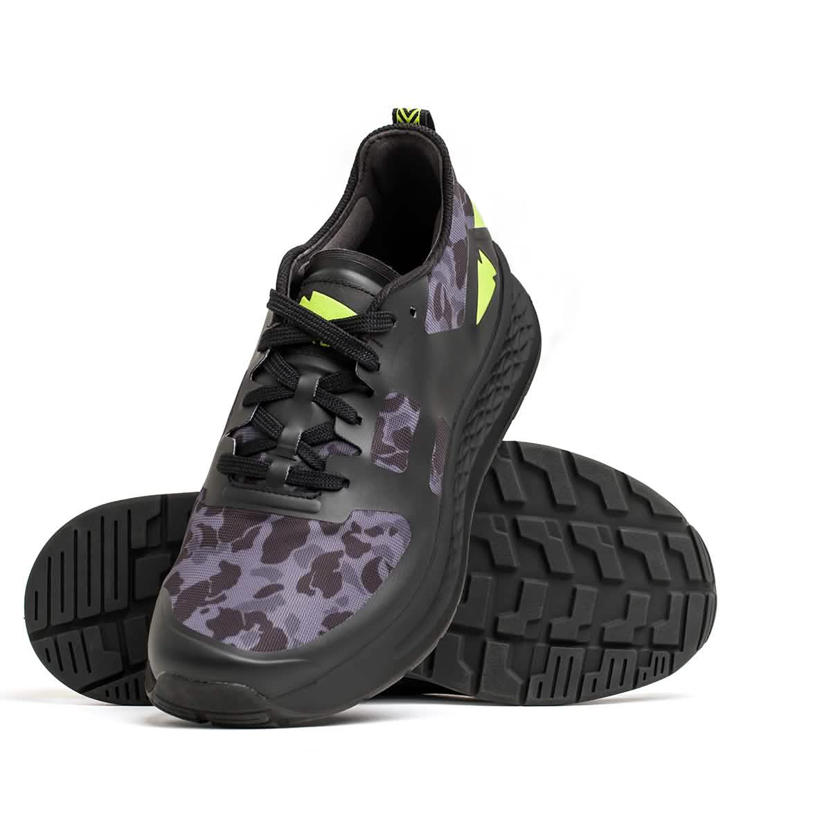 A pair of GORUCK Rough Runner sneakers in Midnight Frogskin camo and Acid Lime accents. Featuring a comfortable EVA Midsole, one shoe stands upright while the other is angled to display its textured sole, highlighting the sleek and modern design.