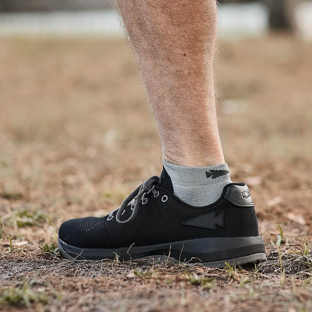 GORUCK black rucking shoe with reflective detail on outdoor trail